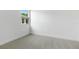Bright bedroom featuring plush carpeting, neutral walls, and a window with a view at 4060 Bannock Ave, Tavares, FL 32778
