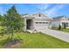 Charming single-story home with a two-car garage and well-manicured lawn at 4060 Bannock Ave, Tavares, FL 32778