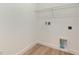 Laundry room featuring wire shelving, white walls, and tile floor at 4060 Bannock Ave, Tavares, FL 32778
