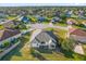 Aerial view of a single Gathering home showcasing the neighborhood and landscaping at 4523 Ashtubula Ct, Orlando, FL 32818