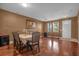 Elegant dining room featuring shiny wood floors and a formal dining table at 4523 Ashtubula Ct, Orlando, FL 32818