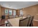 Bright dining room with neutral paint, a ceiling fan, and a formal dining table at 4523 Ashtubula Ct, Orlando, FL 32818