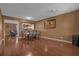 Elegant dining room featuring shiny wood floors and a large dining table at 4523 Ashtubula Ct, Orlando, FL 32818
