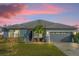 Charming single-story home with a well-manicured lawn and a two-car garage at 4523 Ashtubula Ct, Orlando, FL 32818
