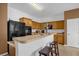 Well-equipped kitchen featuring ample cabinet space and black appliances at 4523 Ashtubula Ct, Orlando, FL 32818