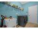 Functional laundry room with modern appliances, a utility sink, and ample storage at 4523 Ashtubula Ct, Orlando, FL 32818