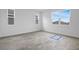 Bright bedroom with neutral paint and carpet flooring with large windows at 5406 Catmint Dr, Lake Hamilton, FL 33851
