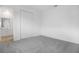 Comfortable bedroom featuring neutral paint and carpet flooring with closet at 5406 Catmint Dr, Lake Hamilton, FL 33851