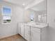 Bathroom with double vanity and tile floors at 1769 Carnelian St, Deland, FL 32720