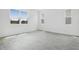 Bright room with three windows providing great natural light and wood-look tile floors at 1769 Carnelian St, Deland, FL 32720