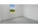 Light and bright bedroom with neutral carpet and a view at 1769 Carnelian St, Deland, FL 32720