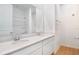 Bathroom with double sink vanity and large mirror reflecting the shower at 1771 Carnelian St, Deland, FL 32720