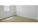 Bright bedroom with neutral carpet and natural light from the window at 1771 Carnelian St, Deland, FL 32720