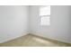 Bright bedroom with neutral carpet and natural light from the window at 1771 Carnelian St, Deland, FL 32720