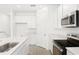 Well-lit kitchen boasts modern appliances, sleek countertops, and ample cabinet space at 1771 Carnelian St, Deland, FL 32720