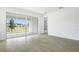 Bright living space with sliding glass doors leading to an outdoor area, showcasing modern flooring at 1771 Carnelian St, Deland, FL 32720