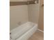 Bathroom featuring a white tiled shower and tub at 1940 Lake Atriums Cir # 93, Orlando, FL 32839