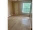 Bedroom showcasing a large window for natural light and a closet at 1940 Lake Atriums Cir # 93, Orlando, FL 32839