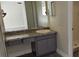 Clean bathroom with granite vanity and gray cabinets at 2118 Allspice Ave, Orlando, FL 32837
