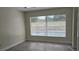 Bright bedroom with large window overlooking the pool at 2118 Allspice Ave, Orlando, FL 32837