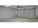 Empty garage with white walls and an open garage door at 2118 Allspice Ave, Orlando, FL 32837