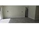 Living room with gray tile floors and access to backyard at 2118 Allspice Ave, Orlando, FL 32837