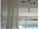Living room with gray tile floor and sliding doors leading to a pool at 2118 Allspice Ave, Orlando, FL 32837