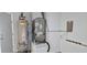 Interior view of a mechanical room with water heater and AC unit at 2118 Allspice Ave, Orlando, FL 32837