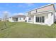 View of backyard featuring a covered patio and manicured lawn at 5418 Catmint Dr, Lake Hamilton, FL 33851