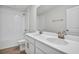 Bathroom featuring double vanity sinks with modern fixtures, and shower-tub combination at 5418 Catmint Dr, Lake Hamilton, FL 33851