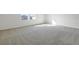 Empty bedroom featuring plush carpet, neutral walls, and abundant natural light at 5418 Catmint Dr, Lake Hamilton, FL 33851
