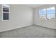 Empty bedroom featuring plush carpet, neutral walls, and abundant natural light at 5418 Catmint Dr, Lake Hamilton, FL 33851