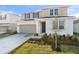 Charming two-story home with a well-maintained lawn and neutral color scheme at 5418 Catmint Dr, Lake Hamilton, FL 33851