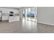 Open kitchen and living area featuring tile floors and sliding glass doors at 5418 Catmint Dr, Lake Hamilton, FL 33851