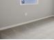 Neutral carpeted bedroom featuring one window and light gray walls at 5422 Catmint Dr, Lake Hamilton, FL 33851