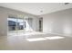 Bright living room with large sliding glass doors that leads to the exterior at 5422 Catmint Dr, Lake Hamilton, FL 33851