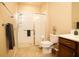 Bathroom featuring a walk-in shower, modern fixtures, and neutral color scheme at 7845 Wandering Way, Orlando, FL 32836