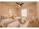 Charming bedroom featuring two twin beds, soft neutral colors and coordinated decor at 7845 Wandering Way, Orlando, FL 32836