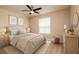 This cozy bedroom features a ceiling fan, comfortable bed, and serene decor at 7845 Wandering Way, Orlando, FL 32836