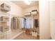 Walk-in closet with organization system, shelving, and ample storage space at 7845 Wandering Way, Orlando, FL 32836