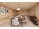 Open dining area with seating for six and modern decor at 7845 Wandering Way, Orlando, FL 32836