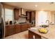 Gourmet kitchen with stainless steel appliances, granite countertops, and ample storage at 7845 Wandering Way, Orlando, FL 32836