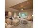 Spacious living room with modern furnishings, fan and sliding glass doors at 7845 Wandering Way, Orlando, FL 32836