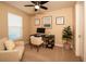 Cozy office space with lots of natural light and modern ceiling fan at 7845 Wandering Way, Orlando, FL 32836