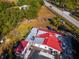 Aerial view of house with red metal roof and lot at 1808 S Tanner Rd, Orlando, FL 32820