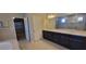 Elegant bathroom with double vanity, soaking tub and separate shower at 3907 Golden Knot Dr, Kissimmee, FL 34746