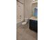 Neutral toned bathroom featuring a tub with shower, a ceramic tile floor, and a dark colored vanity at 3907 Golden Knot Dr, Kissimmee, FL 34746