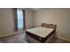 Cozy bedroom with plush carpet, a comfortable bed, and soft window curtains for a relaxing ambiance at 3907 Golden Knot Dr, Kissimmee, FL 34746