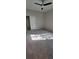 Simple bedroom featuring carpet floors, neutral paint, and a closet with a sliding door and a ceiling fan at 3907 Golden Knot Dr, Kissimmee, FL 34746