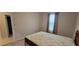 Cozy bedroom with plush carpet, a comfortable bed, and soft window curtains for a relaxing ambiance at 3907 Golden Knot Dr, Kissimmee, FL 34746